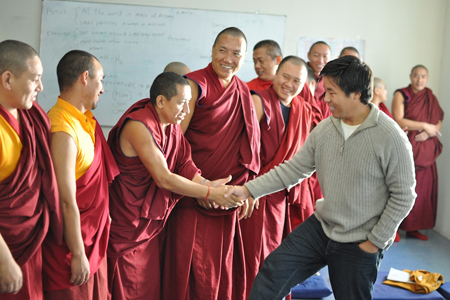Don't offer to shake hands with a monk.