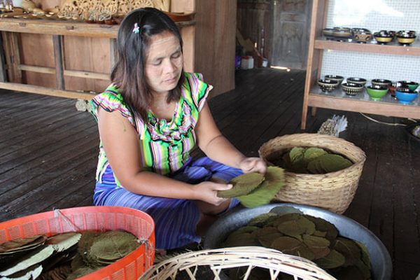 a local woman making cigar in Nampan village