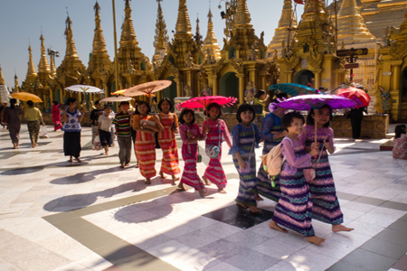 Small children remove their footwears when visiting Shwedagon Pagoda