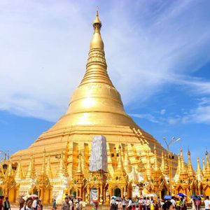 shwedagon pagoda glittering its light on a sunny day