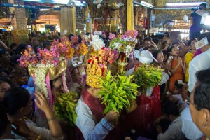 Nat worshippears with braches of Htein Tree on hands