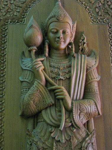 This exquisite carving of a nat spirit adorns one of the main doors to the Mahapasana Cave (see Examination Hall) in Yangon