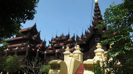 The Shwe In Bin Monastery is a peaceful, beautiful, and interesting place for visitors. With carved teakwood exterior, tiered roof, and surrounding wooden deck, Shwe In Bin is spectacular. Because it's omitted from many guidebooks, the monastery is free of touts and truly relaxing.