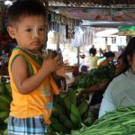 Little boy in a vegetable shop with his mother - Bagan in 2 days