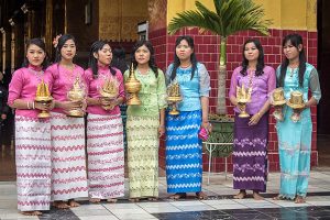 Burmese women wearing longyi-the traditional dress of Myanmar