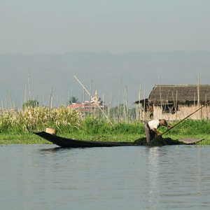 an Inle lake farmer working on his garden