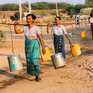 women take water to their home in bagan village