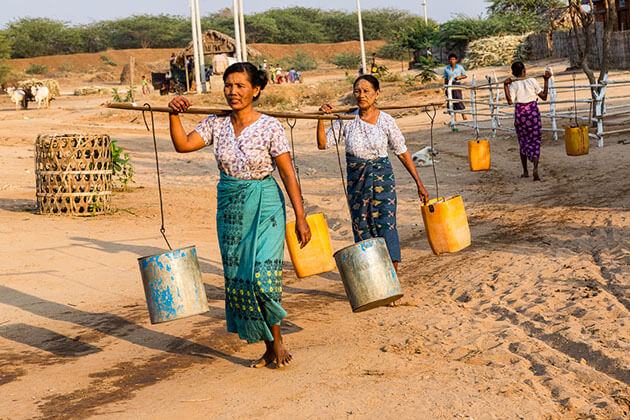 women take water to their home in bagan village