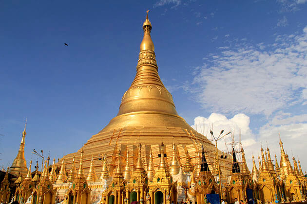 Shwedagon pagoda glittering its golden hue in the sky - yangon tour packages