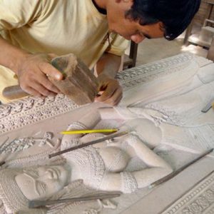An artisan is doing his carving in Artisan D’angkor