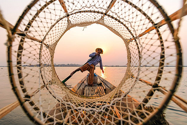Inle Lake leg-rowing fisherman-an iconic image to keep in Myanmar Laos tour package