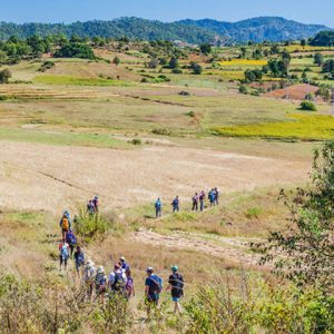 tourists trekking through the scenic landscape of Kalaw