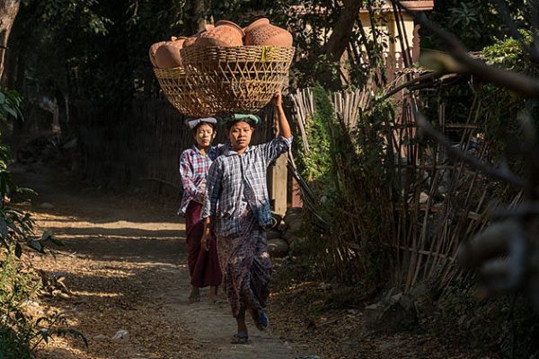 women caring pottery on the head in Yandabo village