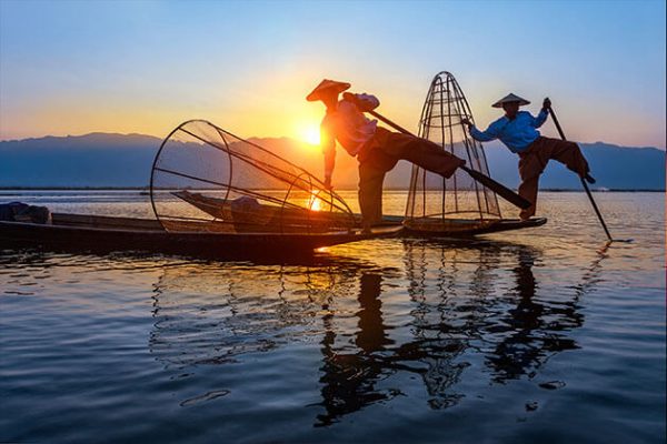 Inle lake scenery and leg rowing fishermen