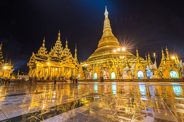 shwedagon pagoda lit up when the night falls